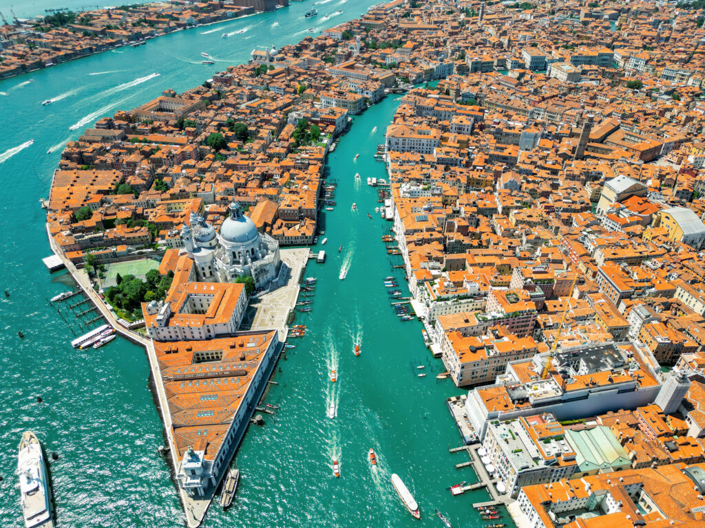 Aerial drone view venice italy water channels with multiple floating moored boats — Itália